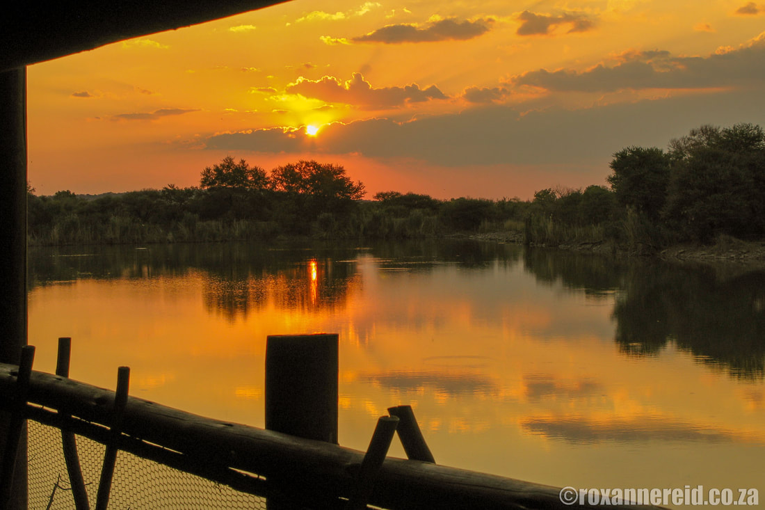 Sunset over the dam at Tlopi Tented Camp, Marakele
